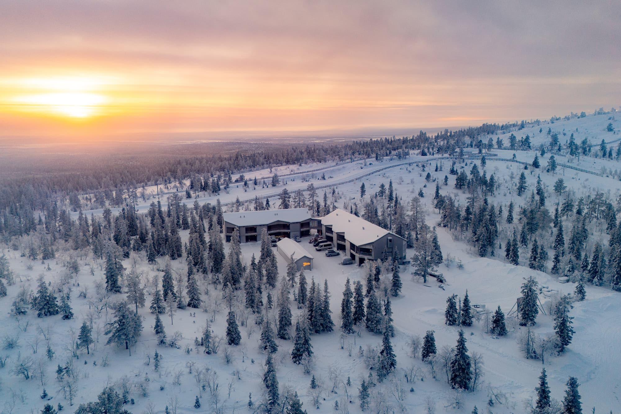 Aerial view of the home on snowy Utsuvaara fell at sunset